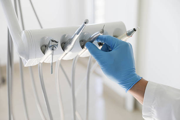 Professional Tooth Extraction technician working in Oswego, IL